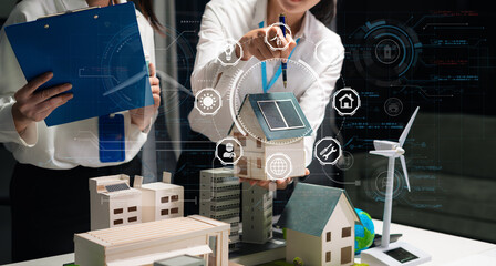 Two colleagues discussing data Construction Site project, green energy and solar panel concept.