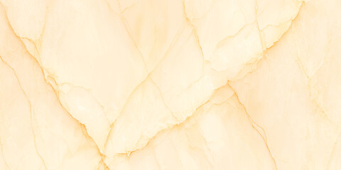 Fototapeta premium A close up view of a creamy pale yellow marble texture with natural veining patterns is displayed