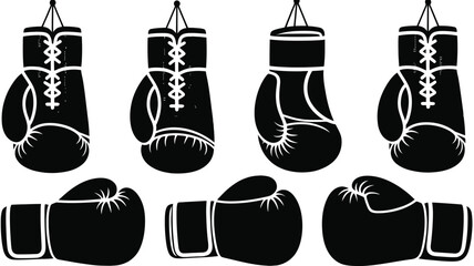 Black and white of hanging and lying boxing gloves