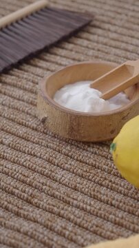 baking soda powder and lemon on a carpet 