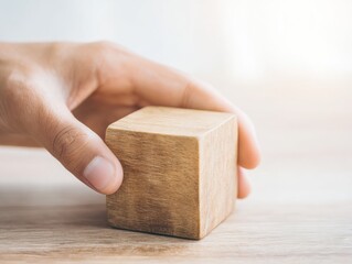 a persons hand assembling a wooden cube to represent efficient and userfriendly information retrieval online