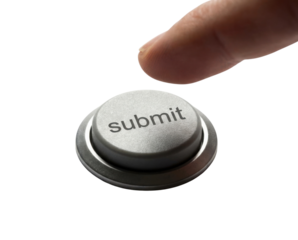 A close-up image of a finger poised to press a metallic "submit" button, typically used in digital interfaces.