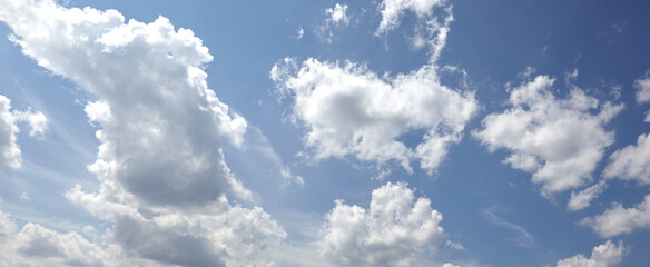 Panoramic photo of blurred sky. Blue sky background with cumulus clouds