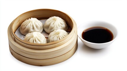 Four steamed dumplings arranged elegantly in a bamboo steamer basket are presented with a side of dark soy sauce against a crisp, clean white background.
