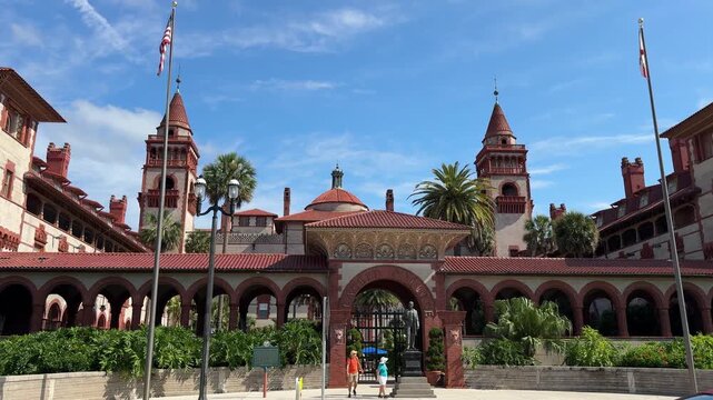 Saint Augustine, Florida, USA, June 25, 2025: A statue of Henry Flagler stands guard at the King Street entry to the Flagler College main entrance. This building was the Ponce de Leon Hotel in 1885.