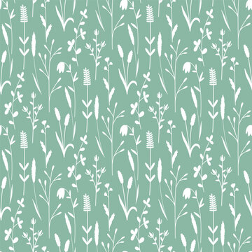 White silhouettes of wildflowers and herbs. Delicate spring seamless pattern . Natural green background with plants. Botanical print for wallpaper, textiles, packaging, tiles, covers, vector