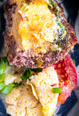 Fresh baked meat with cheese and tomatoes