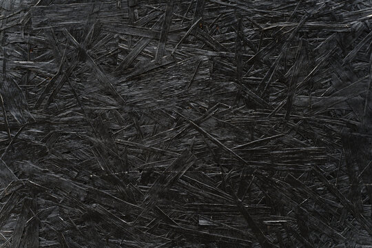 Black Painted OSB Wood Texture Background with Visible Strands