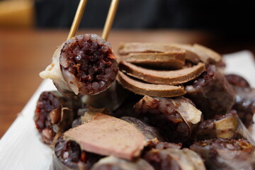 Delicious Korean blood sausage (Sundae) with liver slices, a popular traditional street food