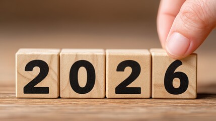 Hand Turning Wooden Blocks to Change Year from 2026 to 2027