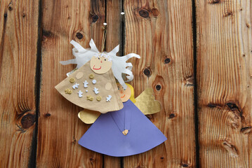Paper angels on wood
