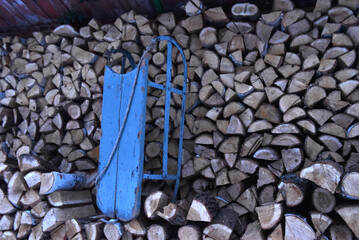  Blue sled by woodpile