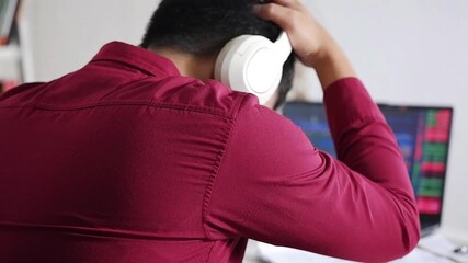 Financier frustrated financial loss looking stock market charts at multiple monitors closeup. Forex trader losing money on crypto exchange sitting office open space. Stressed investor analyzing graphs - Powered by Adobe