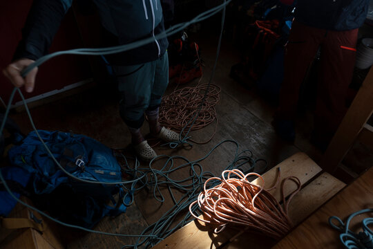 A guide prepares ropes in the backcountry in Canada.