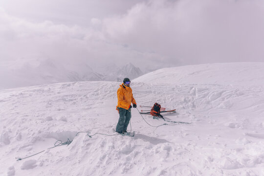 A skier prepares the rope on a glacier in Canada.