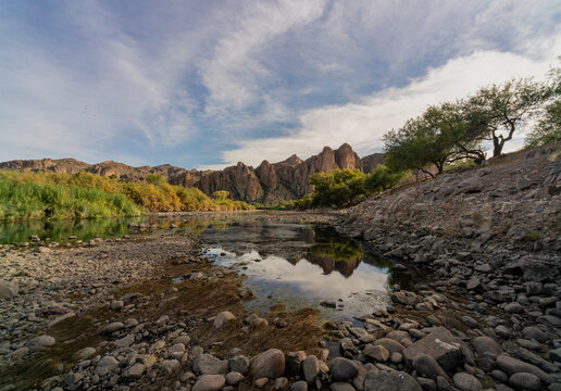 Watershed reflecting mountainous rugged landscape