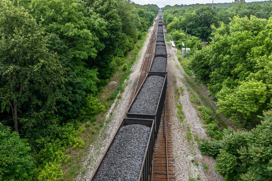Aerial drone view of coal train receding into distance