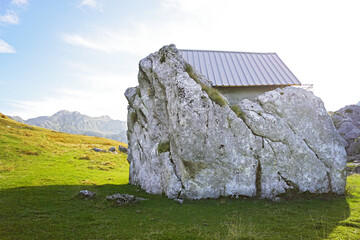 Small cabin built on a massive rock in the Lukavica mountains of Montenegro. Represents off grid living, alpine survival, minimalist architecture, self sufficiency, and remote highland lifestyle.