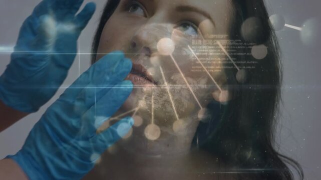 Animation of spinning dna string and data processing over patient