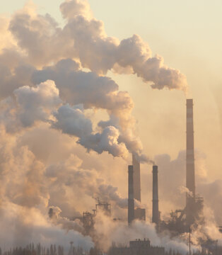 A large factory is emitting smoke into the air