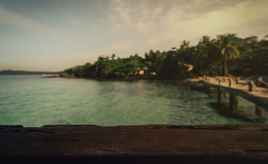 Obraz premium dark wood table on the beach