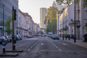 Evening Urban Scene Unfolds, Sunset Illuminates Bustling Cityscape Peacefully