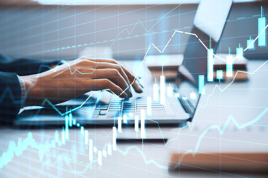 Hands of a trader typing on a laptop with financial graph overlays on screen in office environment, symbolizing digital market analysis and growth. - Powered by Adobe