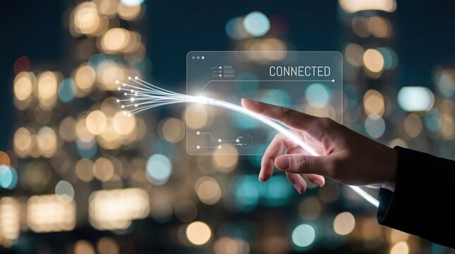 Hand touching fiber optic cable with CONNECTED interface, city lights background Concept of digital network, technology, and communication - Powered by Adobe