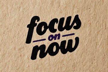 Focus on the present moment: A close-up of the phrase &ldquo;focus on now&rdquo;, it embodies a mindset of mindfulness. It inspires presence, self-awareness, and intentional living.