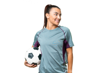 Young football player Woman over isolated chroma key background looking to the side and smiling