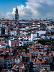 View over the colourful houses towards the Torre dos Clerigos in the old town of Porto, Portugal.