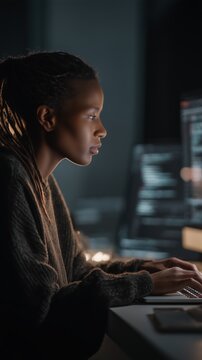 Black Female Software Developer Coding at Night