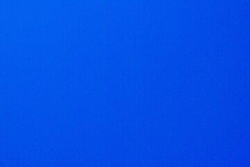 Empty blue sky texture background, full-frame real photograph.