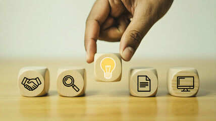 Innovation and strategic planning Hand placing a bright idea lightbulb icon into a sequence of essential business process and digital workflow symbols
