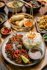 Pad Kra Pao Pork and Holy Basil Stir fry traditional thai food meal on table at restaurant in phuket thailand