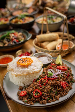 Pad Kra Pao Pork and Holy Basil Stir fry traditional thai food meal on table at restaurant in phuket thailand