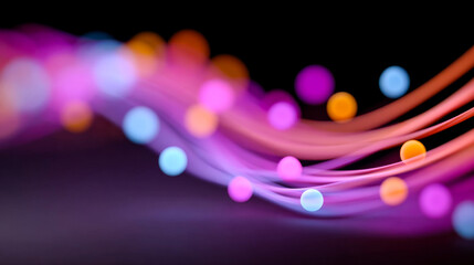 Glowing dot light trails. Bright colored lights move along smooth lines, creating a dynamic scene with glowing orbs.