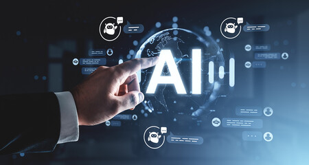 Futuristic AI technology concept with hand touching glowing AI text and holographic chatbot icons on digital background interface in blue tones.
