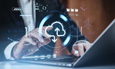 Businessman interacting with cloud upload download symbol on digital interface, representing global digital storage concept and service background.