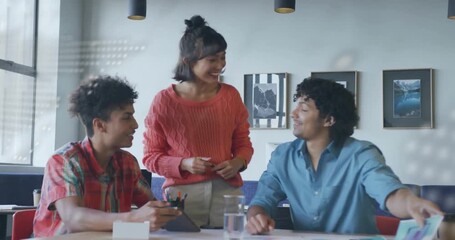 Animated code overlay fading reveals colleagues marking tablet and reviewing diagrams for business - Powered by Adobe