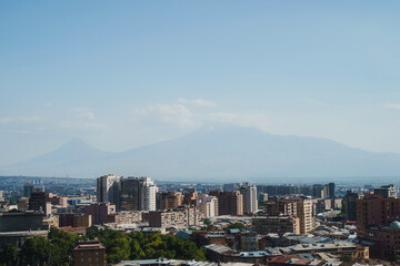 Breathtaking panoramic view of Yerevan city skyline with the majestic Mount Ararat under a clear blue sky in Armenia