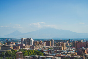 Breathtaking panoramic view of Yerevan city skyline with the majestic Mount Ararat under a clear blue sky in Armenia