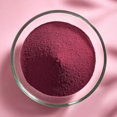 Beetroot powder on clear glass plate, clean minimal, reflections, commercial photography