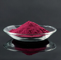 Beetroot powder on clear glass plate, clean minimal, reflections, commercial photography