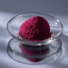 Beetroot powder on clear glass plate, clean minimal, reflections, commercial photography