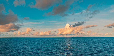 Ecology meditation picturesque ocean horizon nature scene sunset with vibrant clouds sky calm water inspiring landscape serene tropical seascape relaxing summer wallpaper panoramic travel background
