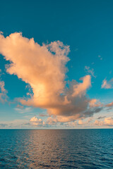 Ecology meditation picturesque ocean horizon nature scene sunset with vibrant clouds sky calm water inspiring landscape serene tropical seascape relaxing summer wallpaper panoramic travel background