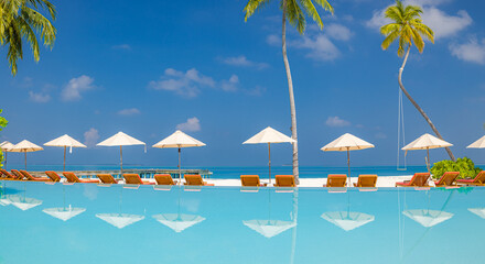 Luxury summer vacation beach resort leisure lifestyle features infinity pool palm trees calm ocean view tropical travel leisure relaxation sunny coastal landscape background. Remote tranquil wallpaper