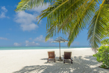 Sunny sky ocean view luxury beach resort scene with love chairs under umbrella palm trees sandy shore. Calm tropical summer vacation romantic travel background. Beautiful tourism inspire nature