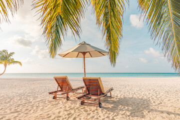 Romantic honeymoon beach scene with love couple resting on sun beds under umbrella tropical island ocean view serene summer vacation luxury resort travel background